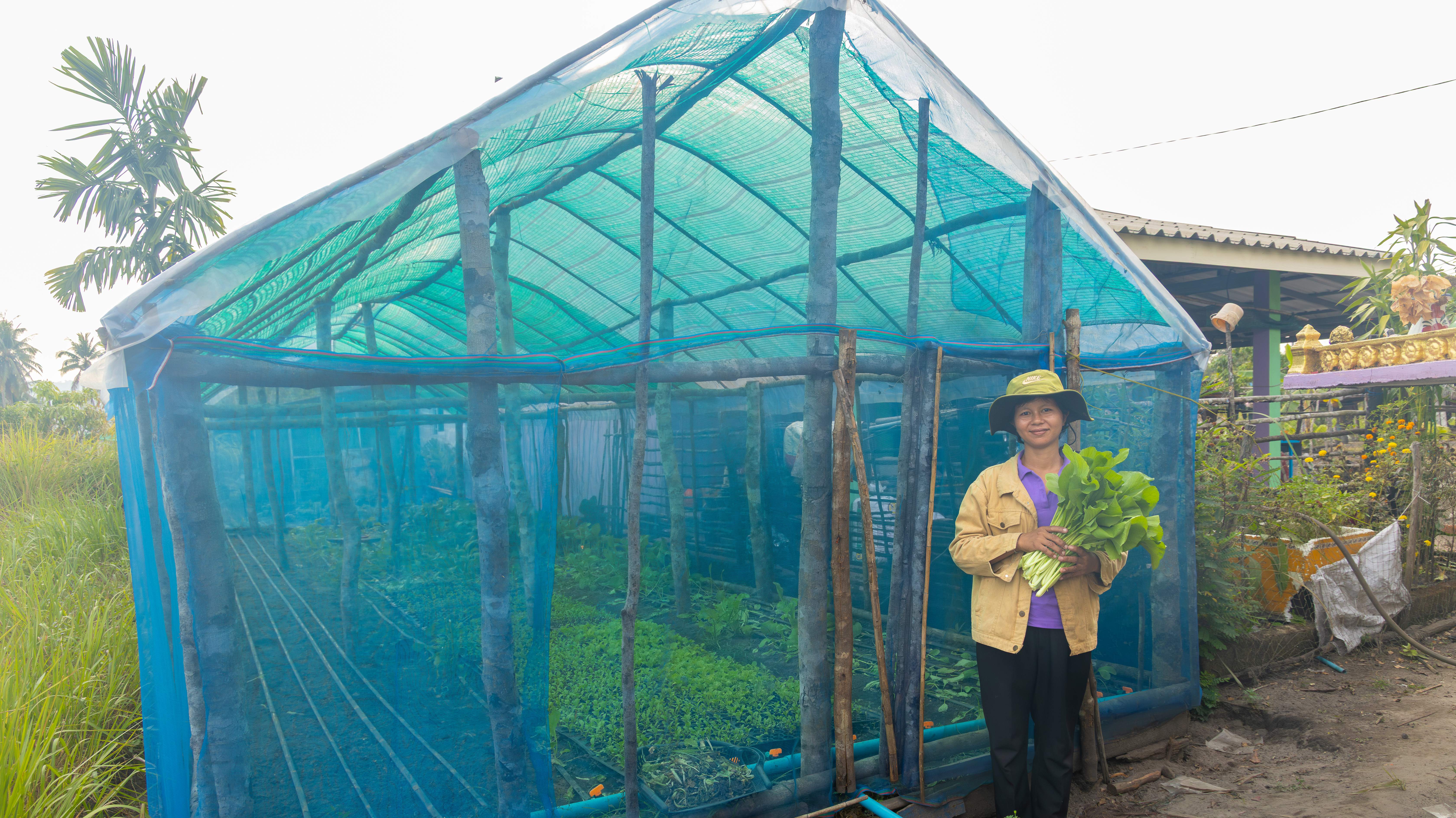 Saychhun in Front of Her Net house
